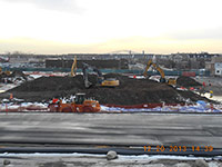 December 2013 - Contractor works on a soil pile